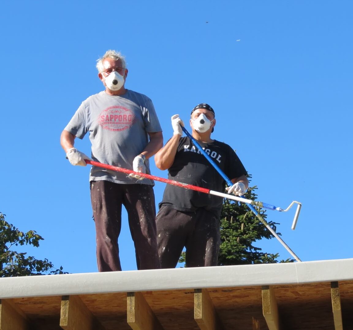 Customers working on fibreglass roof